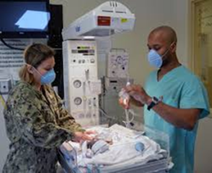 Health care providers treat a neonate.